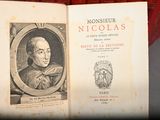 an old book with a picture of a man on it