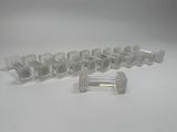 several pieces of clear plastic that are on a white surface
