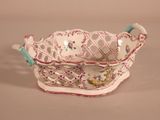 a white and pink bowl with a bird on it