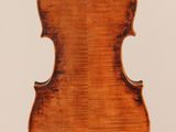 an old violin with a wooden back and a long neck