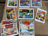 a lot of comic books on the table