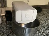 an image of a mixer on the floor in a kitchen