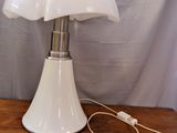 an image of a lamp that is on a wooden table