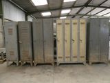 several metal lockers are lined up in a room with a skylight