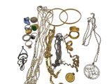 many different types of necklaces and bracelets on a white background
