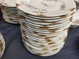 a lot of plates that are stacked on a table
