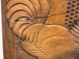 a wooden box with a carved design on it