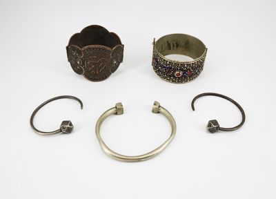 a collection of silver bracelets and bangles