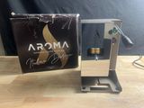 une photo d'une boîte de parfums posée sur une table en bois