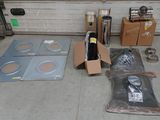 a lot of items that are on the floor in front of a garage door