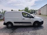 a white van that is parked on the side of the road