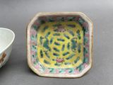 a small bowl and a smaller bowl sitting on a table