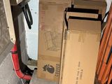 a pile of boxes sitting in the corner of a room