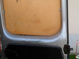a car door that is open on the side of the road
