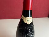 a bottle of wine that is sitting on a table
