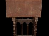 an old wooden table with a wooden top on a black background