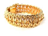gold plated bracelet with braid design on a white background
