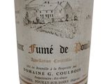 a bottle of wine that is sitting on a table
