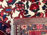 a close up of a rug with a piece of leather on top of it