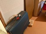 a piece of luggage sitting on the floor next to a door