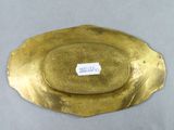 an image of a gold plate with a label on it