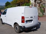 a white van that is parked on the side of the road