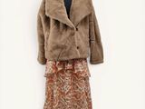 a woman ' s jacket and skirt on a mannequin mannequin mannequin mannequin mannequin mannequin mannequin manne