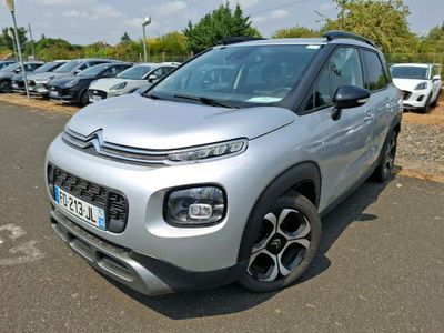 the silver citrole is parked in a parking lot with other cars