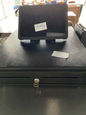 a black cash register sitting on top of a black table