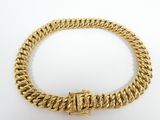 a gold chain bracelet with a clasp on a white background