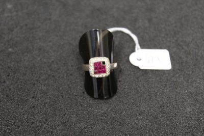 a close up of a ring on a table with a price tag