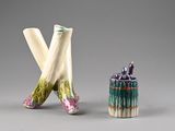 two small vases that are sitting next to each other