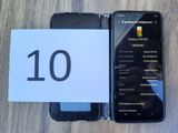 a picture of a cell phone and a note with the number 10 on it