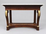 an antique console table with marble top