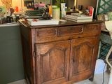 an image of a kitchen with a bar stool and a sink