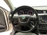 the interior of a car with a steering wheel and dashboard controls