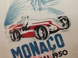 a poster of a racing car on display in a museum