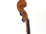 the back of a violin that is sitting on top of a table