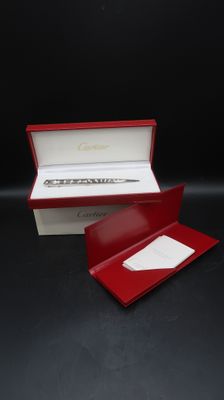 an image of a red box with a watch inside of it