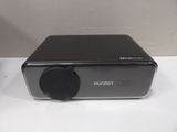 a close up of a black radio sitting on top of a white table
