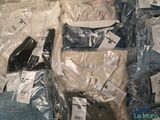 a lot of clothes that are wrapped in plastic bags