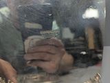 a person taking a picture in a mirror with a cell phone