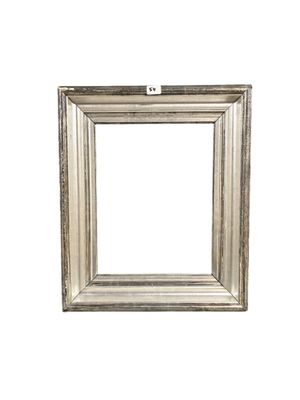 a white picture frame with a silver border on a white background