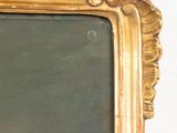 a gold frame with a picture of a man in it