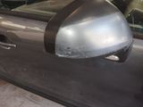 a car that has a mirror on the side of it