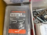 a box of screws and screw nuts in it