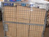 a metal cart with boxes on top of it in a warehouse