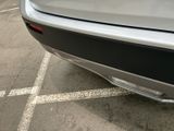 a close up of a car ' s rear bumper with a sticker on it