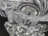a close up of a glass vase with a flower on it