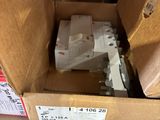 a box full of electrical equipment sitting on the floor